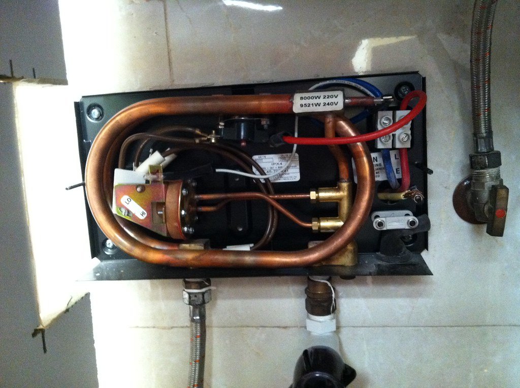 Tankless water heater installed in an Arvada home by a licensed plumber